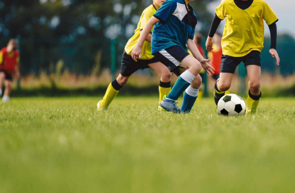 A group of kids playing soccer.