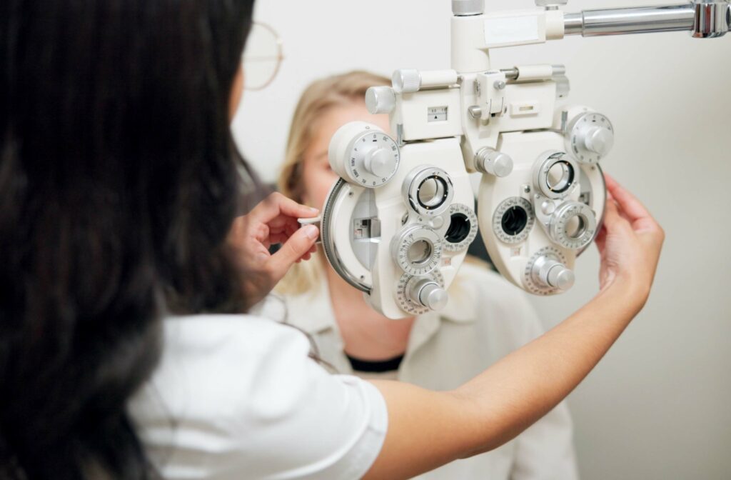 An optometrist prepares to test their patient's vision to determine their prescription.